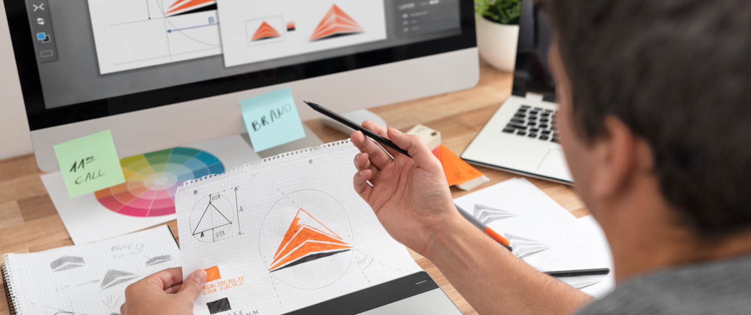 Graphic Designer drawing ketches and logo design for a private investigator